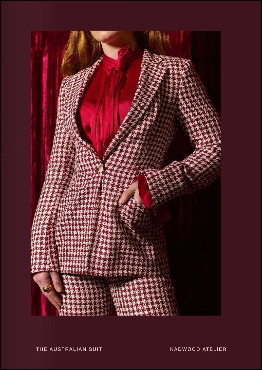 Close up of tailored bodice in The Australian Suit in burgundy beige houndstooth silk-linen-cotton blend by Carnet Como Italy, styled with a red silk blouse as a status symbol of success and bespoke personality, crafted exclusively for women by Kadwood Atelier.