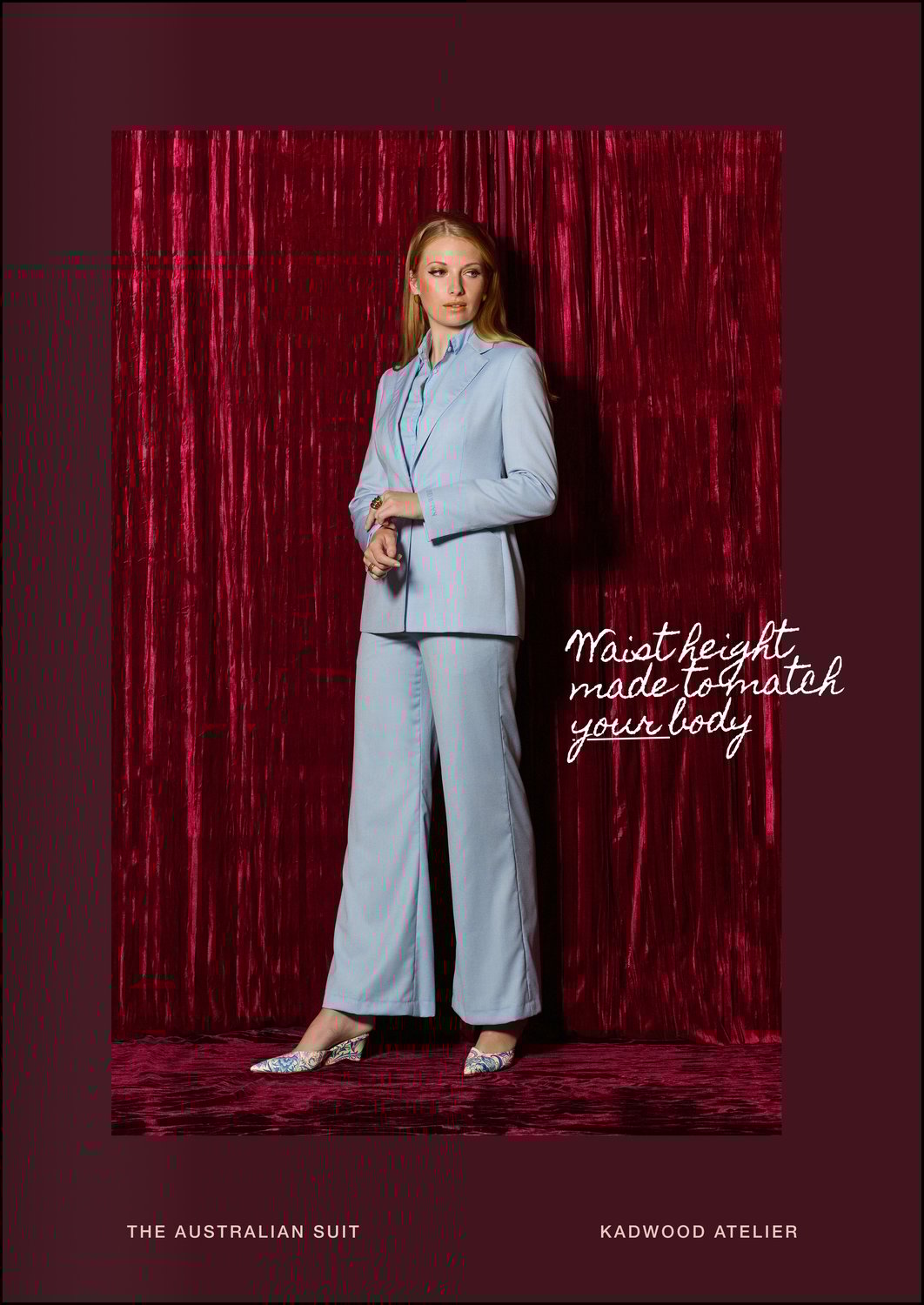 Three quarter view of a woman wearing The Australian Suit in pastel blue two toned tropical weave by Zignone designed by Creative Director Erin Kadwood and crafted ethically in London and Prague by Kadwood Atelier a global leader in womens bespoke suiting