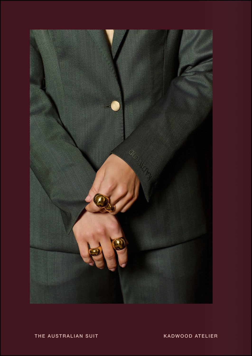 The Australian Suit Close up of the herringbone green Merino wool weave and embroidered KADWOOD cuff on The Australian Suit by Creative Director Erin Kadwood at Kadwood Atelier where tailoring elevates and connects women