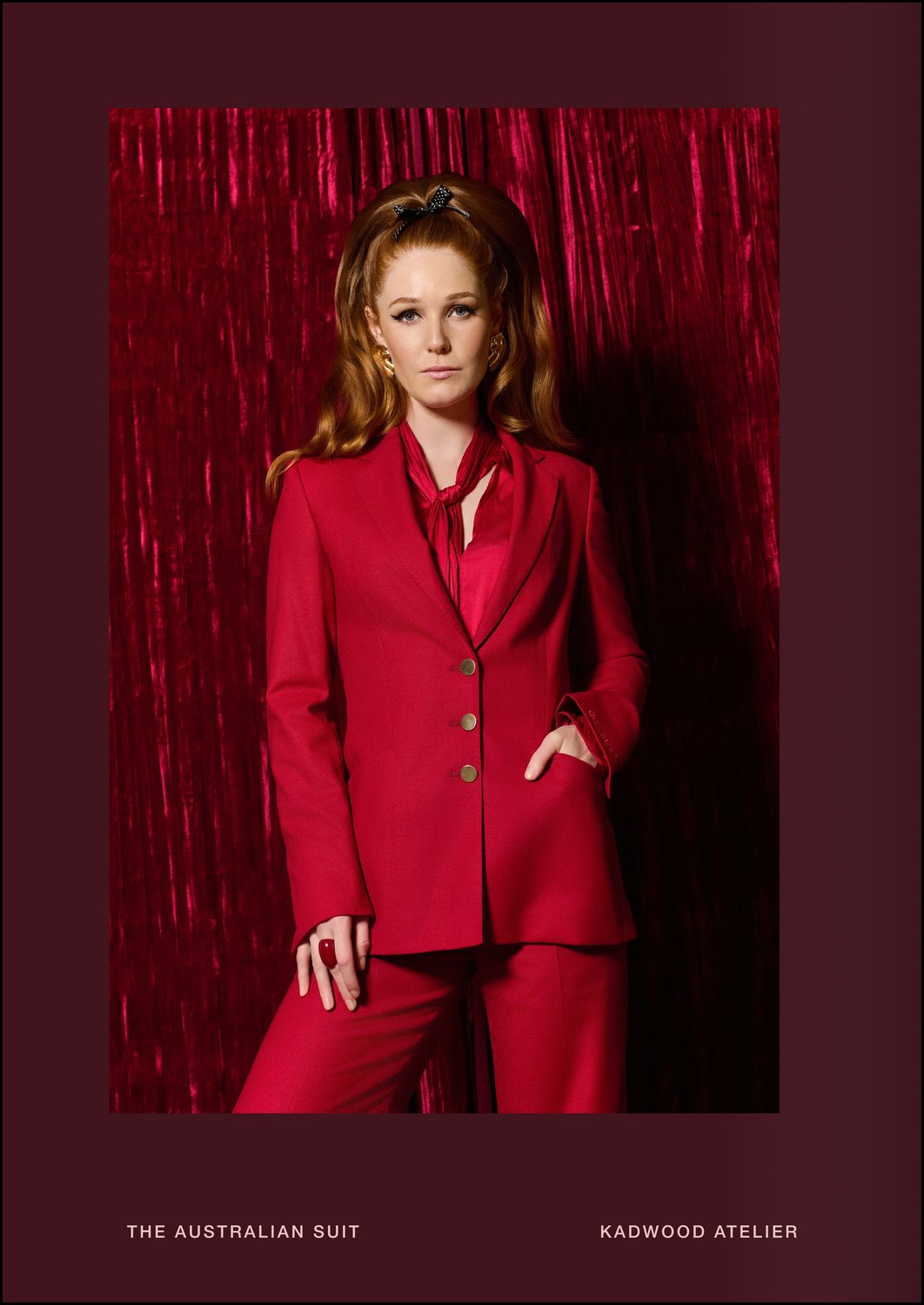Close up of rich crimson wool crepe texture and personalised Kadwood cuff embroidery on The Australian Suit by Erin Kadwood symbolising success and wealth exclusively for women